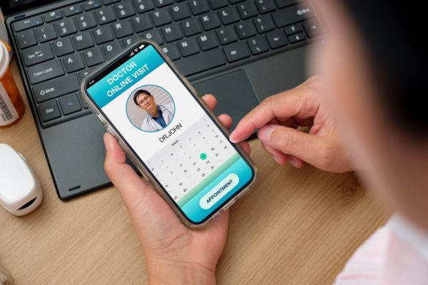 asian woman appointment consulting doctor visit on mobile app at home.telemedicine